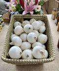 Australian White Onions in a thatched basket around other produce items